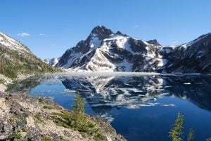 Sawtooth Lake With Floating Ice & Mount Regan In Distance