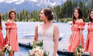 Bride and bridesmaid in front of Sawtooth Mountains