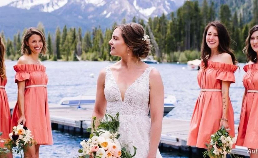 Bride and bridesmaid in front of Sawtooth Mountains